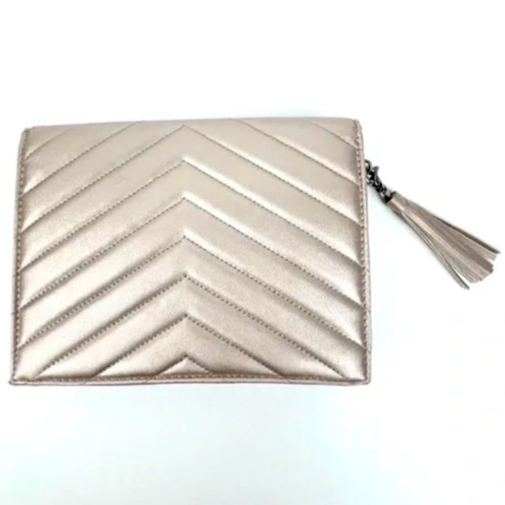 Neiman Marcus champagne gold metallic quilted clutch with tassel charm